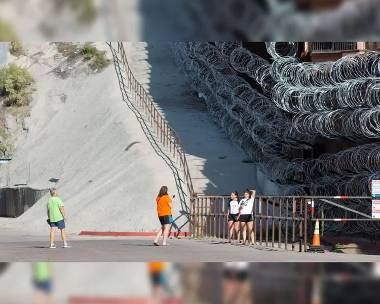 Retiran alambre de puas de muro fronterizo